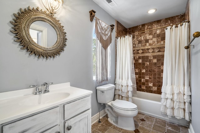 full bathroom featuring shower / bath combo with shower curtain, vanity, and toilet