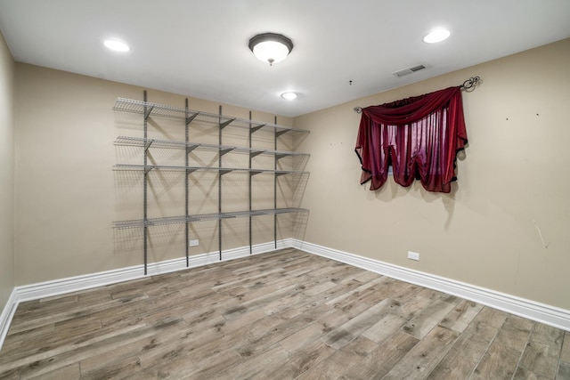 unfurnished room featuring wood-type flooring