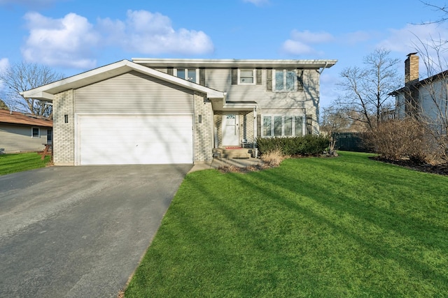 view of front facade with a garage and a front yard