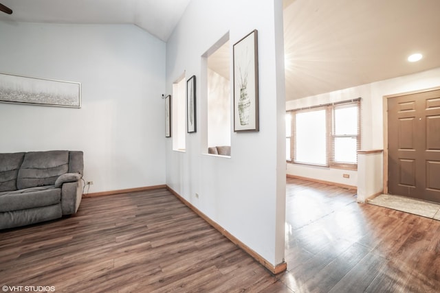 interior space with hardwood / wood-style floors and vaulted ceiling