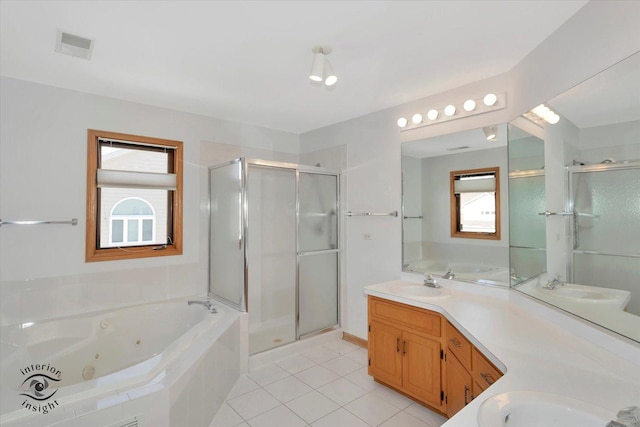 bathroom featuring shower with separate bathtub, a wealth of natural light, vanity, and tile patterned flooring