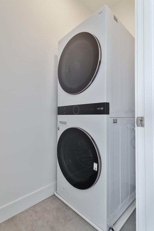 washroom with stacked washer / dryer