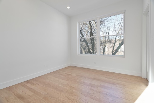 unfurnished room featuring light hardwood / wood-style floors