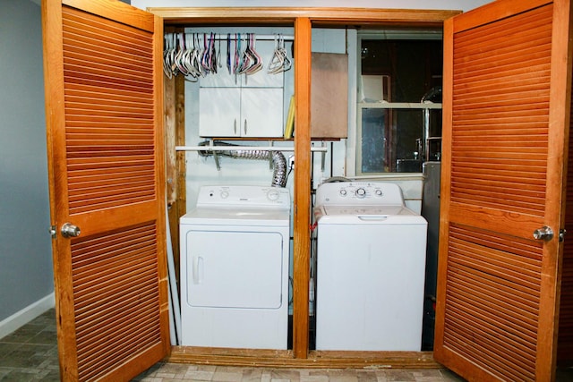 laundry room with separate washer and dryer