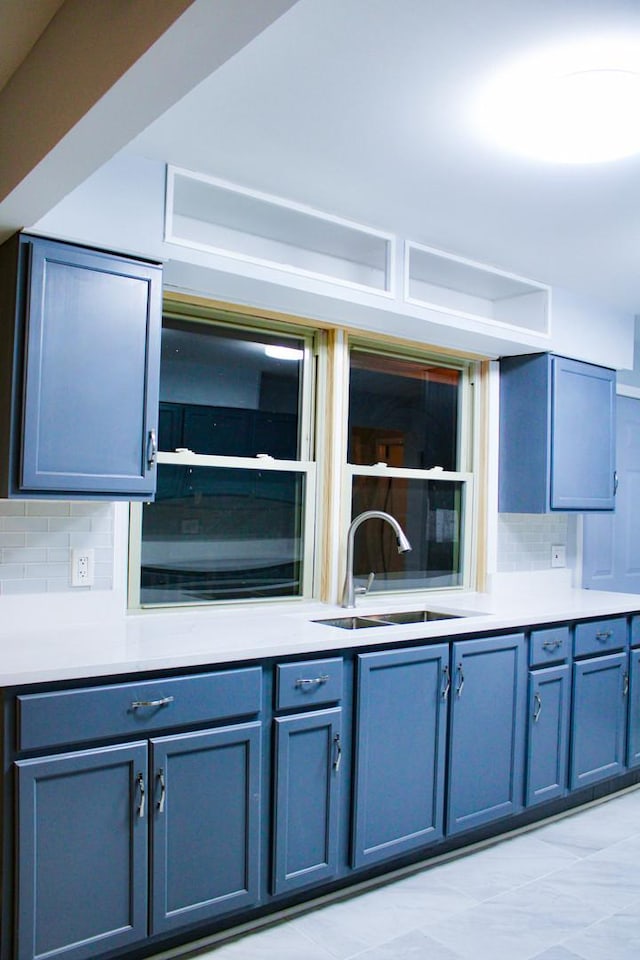 kitchen with backsplash and sink