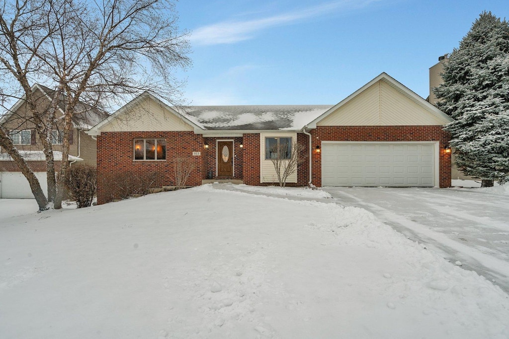 ranch-style house featuring a garage