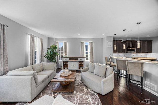 living room with dark hardwood / wood-style floors