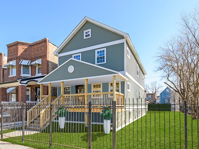 view of front of property with a porch and a front yard