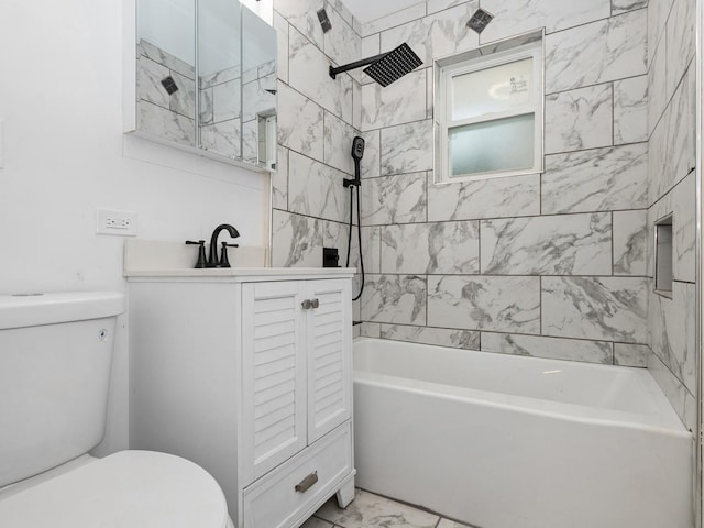 full bathroom featuring vanity, toilet, and tiled shower / bath