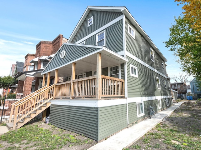 rear view of house with covered porch