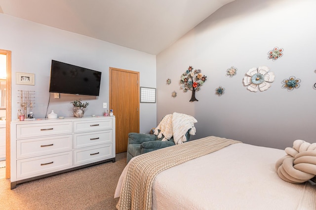 bedroom with carpet flooring and lofted ceiling