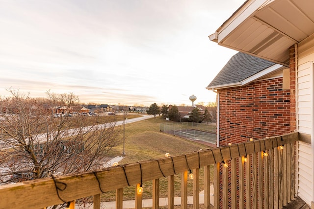 view of balcony at dusk