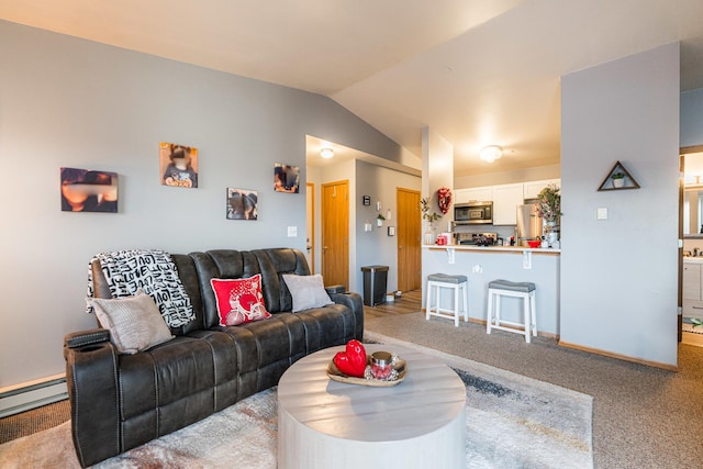 carpeted living room with a baseboard heating unit and vaulted ceiling