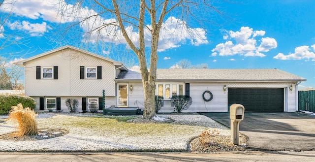 split level home featuring a garage