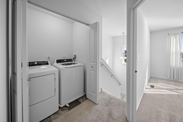 laundry room with carpet flooring and washing machine and clothes dryer