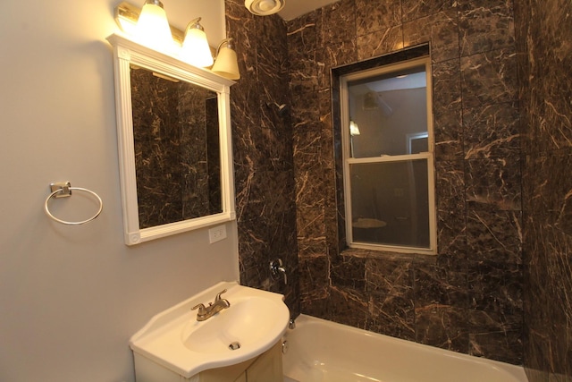 bathroom with washtub / shower combination and vanity