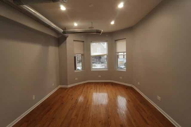 empty room featuring hardwood / wood-style flooring