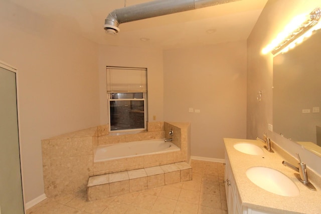 bathroom featuring vanity, tiled bath, and tile patterned floors