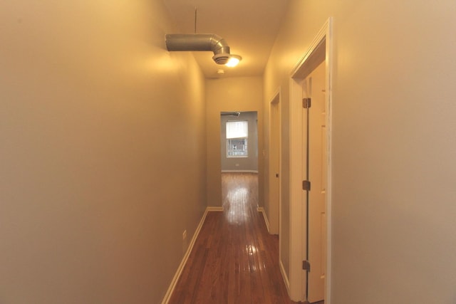 hallway with dark wood-type flooring