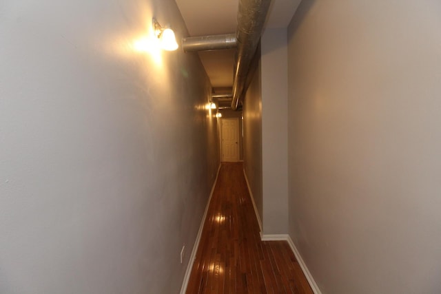 corridor featuring dark hardwood / wood-style floors