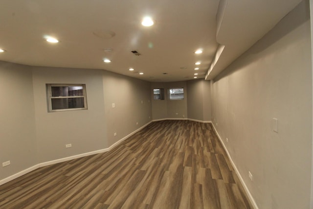 basement featuring dark hardwood / wood-style flooring