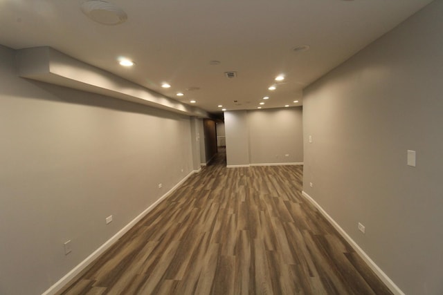 basement featuring dark hardwood / wood-style floors