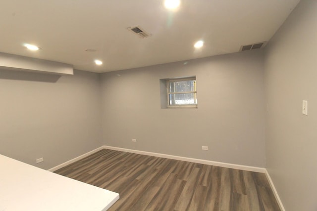 basement featuring dark wood-type flooring