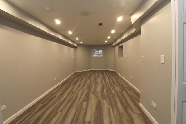 basement featuring dark wood-type flooring