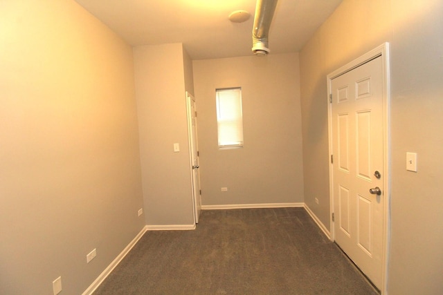 hallway with dark carpet