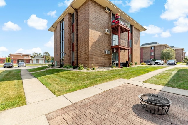 view of building exterior featuring a fire pit