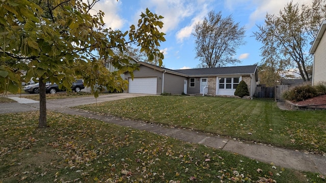 ranch-style house with a front lawn and a garage