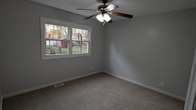 empty room featuring visible vents, baseboards, ceiling fan, and carpet flooring