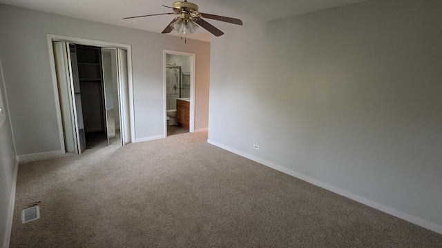 unfurnished bedroom featuring a closet, visible vents, baseboards, and carpet