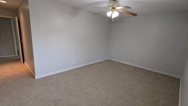 empty room with baseboards, carpet, and ceiling fan