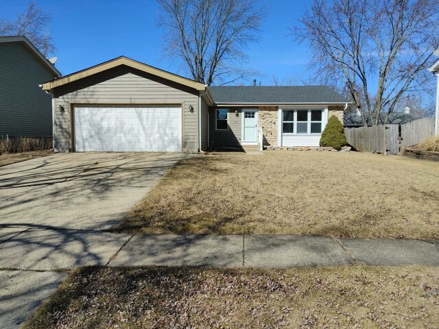 ranch-style house with driveway, roof with shingles, and an attached garage