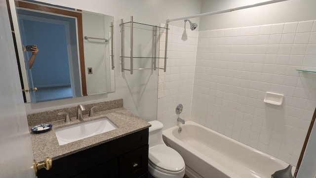 full bath featuring vanity, toilet, and shower / bath combination