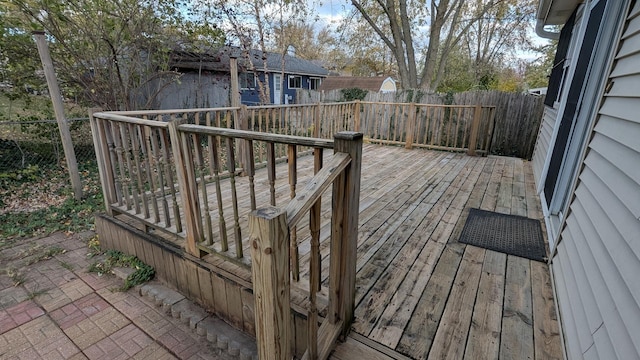 wooden terrace featuring a fenced backyard