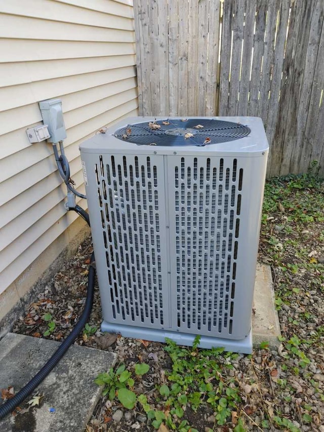 details with central air condition unit and fence