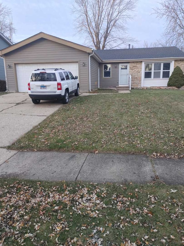 view of front of property featuring entry steps, concrete driveway, a front yard, a garage, and stone siding