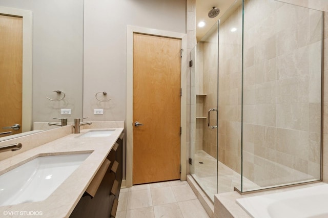 bathroom featuring tile patterned floors, vanity, and an enclosed shower