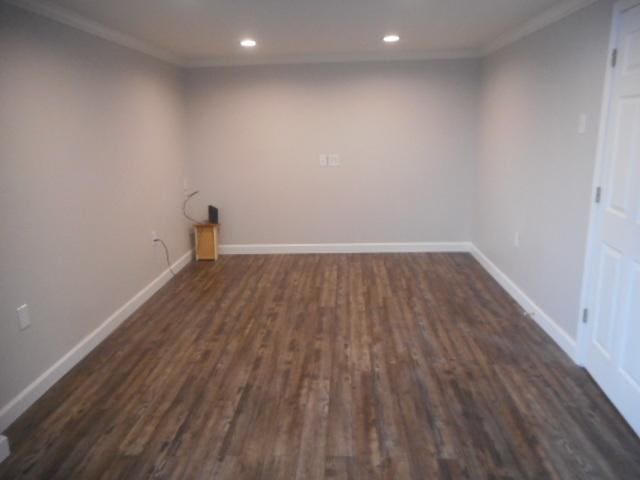 clothes washing area featuring baseboards, dark wood finished floors, crown molding, and recessed lighting