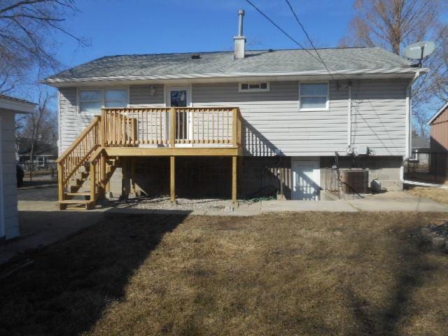 back of property with cooling unit, stairway, and a wooden deck