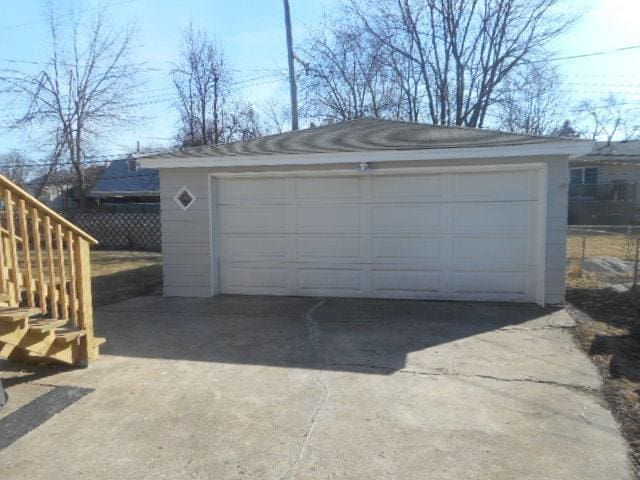 detached garage with fence