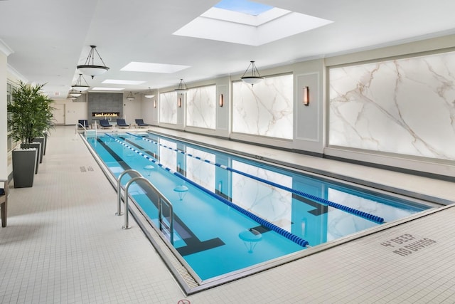 view of pool featuring a skylight