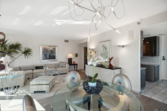 dining area featuring a chandelier and hardwood / wood-style flooring