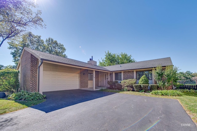 single story home featuring a garage