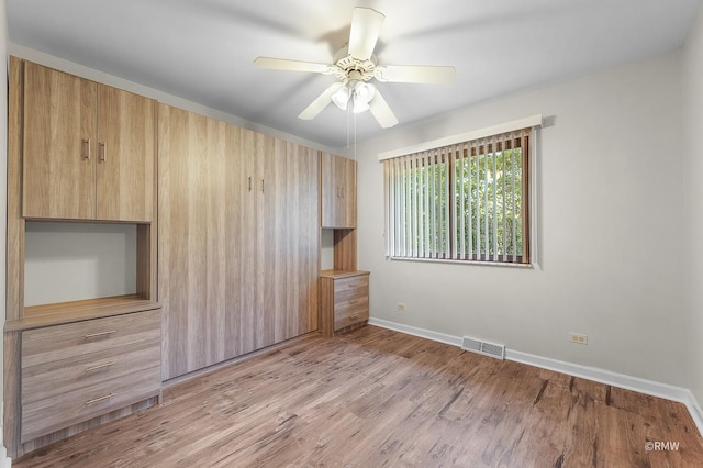 interior space featuring light wood-type flooring and ceiling fan