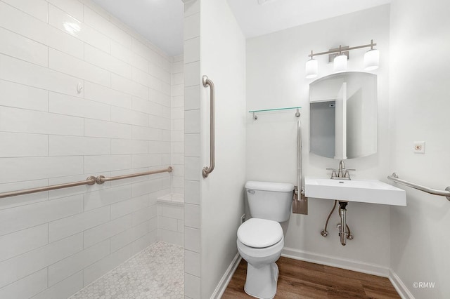 bathroom with sink, hardwood / wood-style floors, and toilet