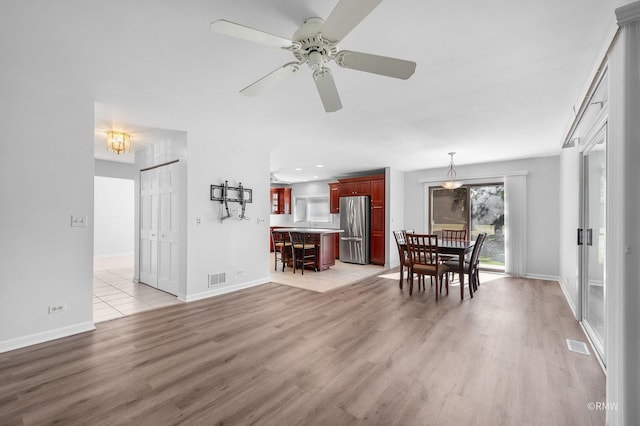 interior space featuring light wood-type flooring and ceiling fan