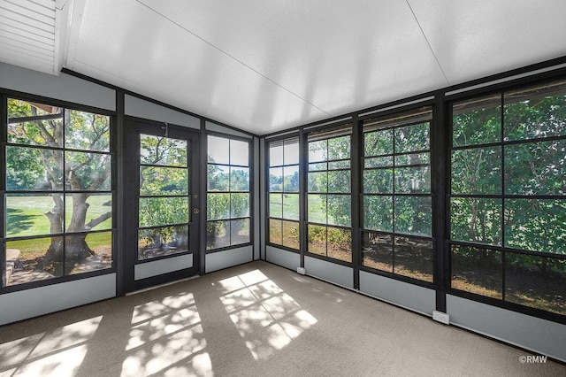 unfurnished sunroom with vaulted ceiling